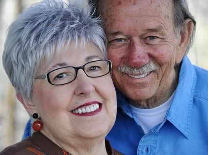 Senior couple smiling with healthy restored smiles in Annapolis, MD