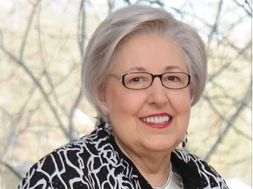 Senior woman smiling after cosmetic dental treatment in Annapolis, MD